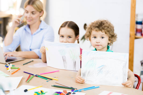 istock Children with pictures 1006670564