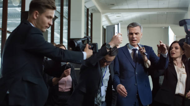 istock Politician escaping from nosy journalists 1006674890