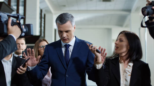 istock Politician escaping from nosy journalists 1006675110