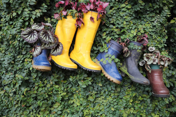 istock Garden Decoration Plastic Boot Hanging on Leaf Wall 1006677616