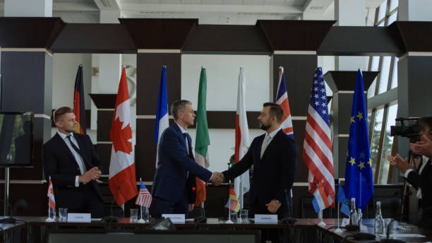 istock Politicians shaking hands in agreement on negotiation 1006677738