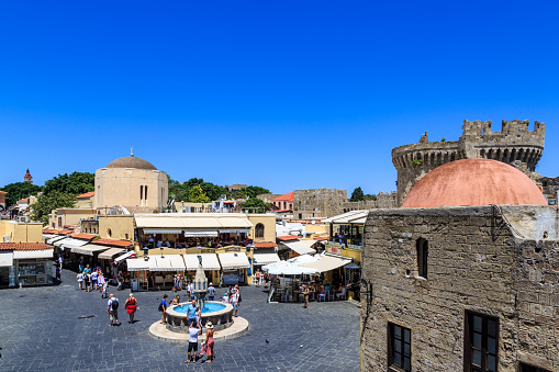 Rhodes town, Rhodes, Greece - July 7, 2018 : Hippocrates square with shops in old castle town area of Rhodes, Greece.