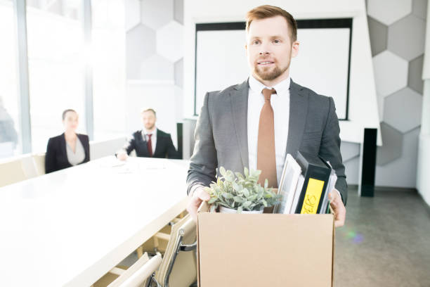 istock Smiling Young Businessman Quitting Job 1006682746