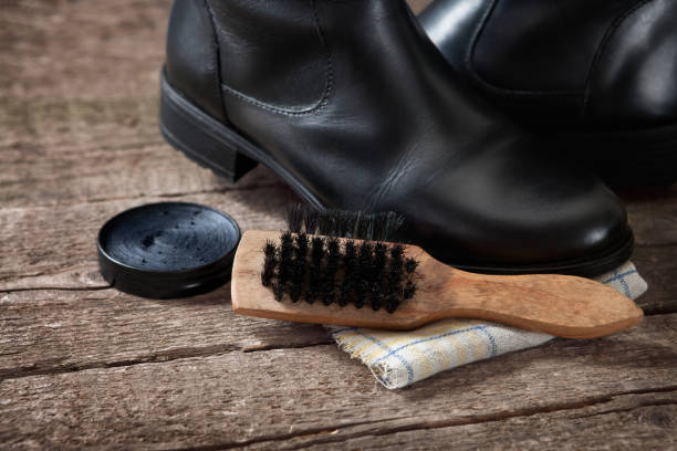 istock Brush with black boot and polish cream 1006684916