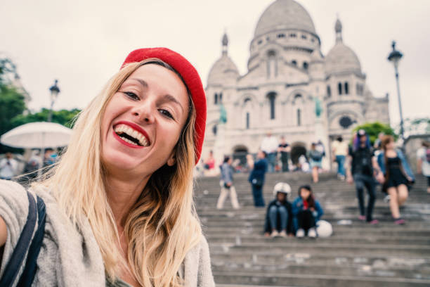 istock Young woman taking selfie in Paris using mobile phone, scare coeur 1006687306