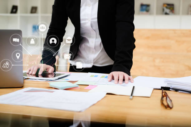 istock Business woman working with tablet computer analysis data of finance and visual icon technology. 1006688006