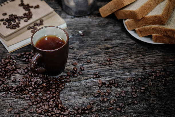 istock Breakfast Coffee morning and bread on rustic wooden table. 1006688114