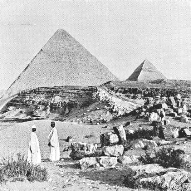 istock Two Men at the Great Pyramids in Giza, Egypt - Ottoman Empire 1006691064