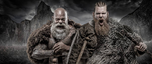 bearded tattooed viking warrior king and prince in front of warrior hoard and background - tattoo father family son imagens e fotografias de stock