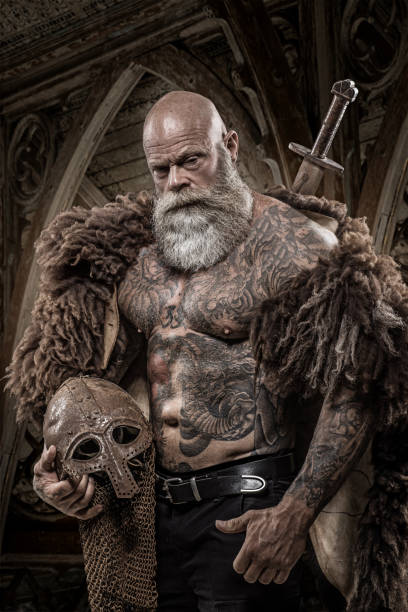 Bearded Tattooed Viking Warrior King In Front Of Warrior Hoard And  Background Stock Photo - Download Image Now - iStock