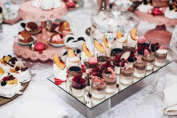 istock delicious candy bar at luxury  wedding reception. exclusive expensive catering. table with modern desserts, cupcakes, sweets with fruits. space for text. baby or bridal shower. holiday celebration 1006692528