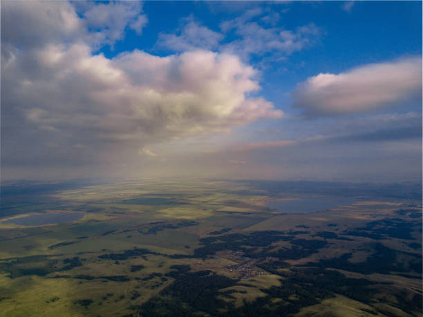 istock Panoramic view from drone of the fields near mountains 1006696512