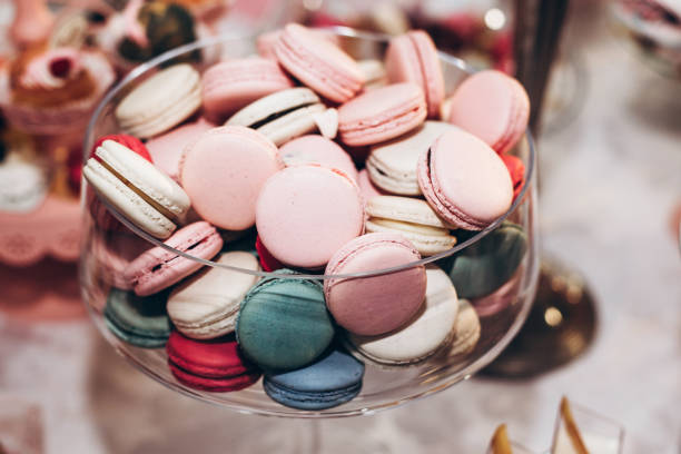istock delicious macaroons close-up. candy bar at luxury wedding reception. exclusive expensive catering. table with modern desserts. space for text. baby or bridal shower. holiday celebration 1006697310