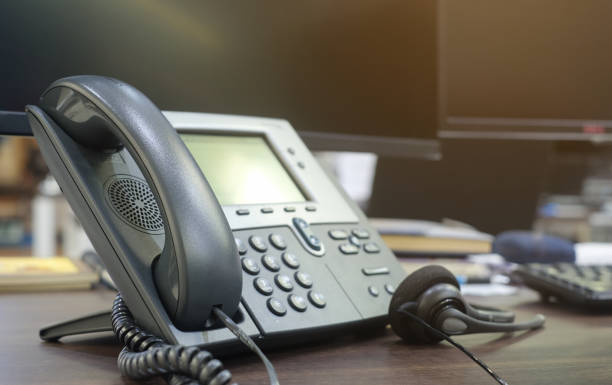 istock close up soft focus on telephone devices at office desk for customer service support concept 1006697542