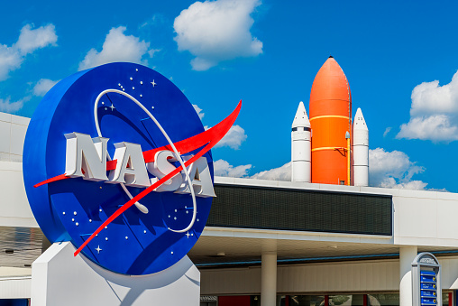 Cape Canaveral, FL, USA - April 1, 2015: NASA Logo and Atlantis Space Shuttle at Kennedy Space Center Visitor Complex in Cape Canaveral, Florida, USA.