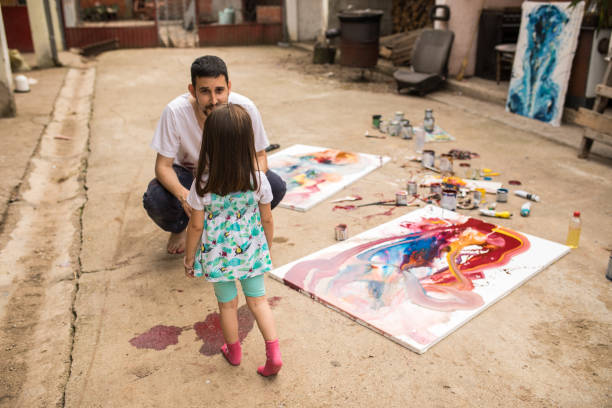 istock Father and daughter having fun in the backyard 1006721220