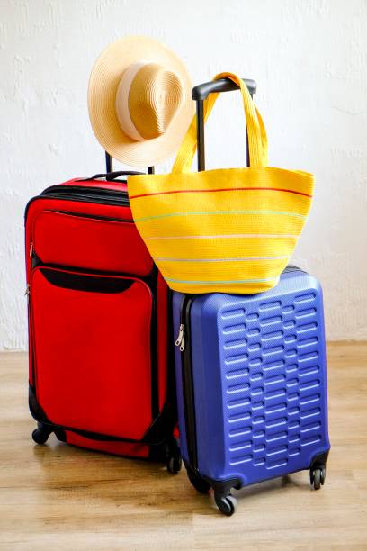 istock Minimalistic composition with suitcase luggage for summer vacation. Travel light concept. 1006738486