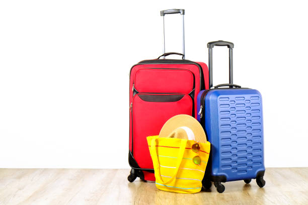 istock Minimalistic composition with suitcase luggage for summer vacation. Travel light concept. 1006738670