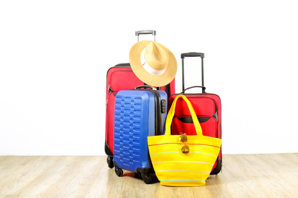 istock Minimalistic composition with suitcase luggage for summer vacation. Travel light concept. 1006738718