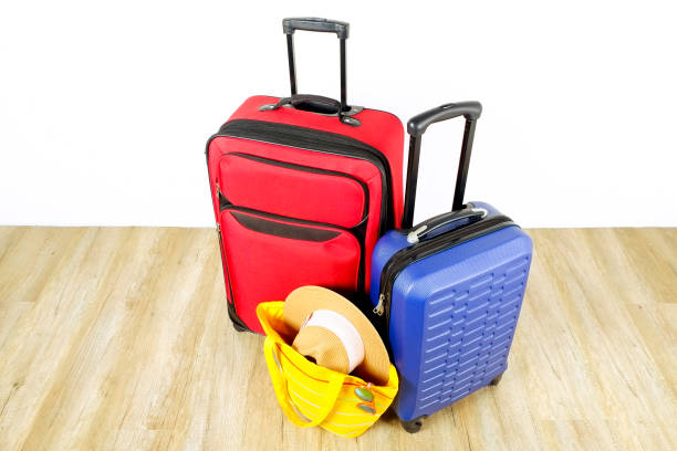 istock Minimalistic composition with suitcase luggage for summer vacation. Travel light concept. 1006738732