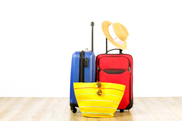 istock Minimalistic composition with suitcase luggage for summer vacation. Travel light concept. 1006738842