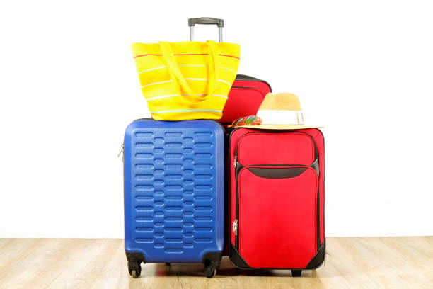 istock Minimalistic composition with suitcase luggage for summer vacation. Travel light concept. 1006738998