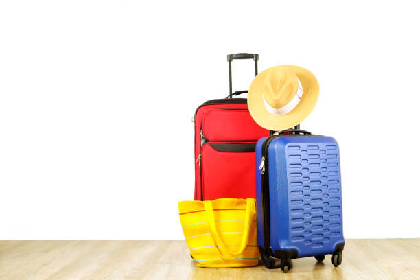 istock Minimalistic composition with suitcase luggage for summer vacation. Travel light concept. 1006739246