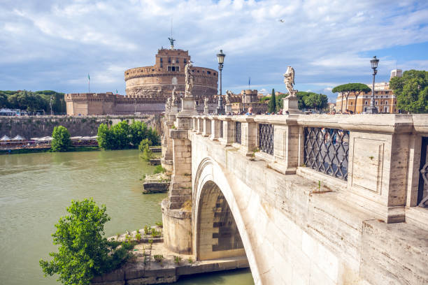 Rome, Italy, April 11 -- A dark sky looms over Castel Sant'Angelo near the Vatican and St. Peter's Basilica. Built around 123 AD as a sepulcher for Emperor Hadrian and his family, the current Castel Sant'Angelo was used as a fortress, prison and refuge by the Popes, connected to the Vatican by a long narrow narrow corridor called 'Passetto'. It is currently owned by the Italian state and is used for visits and cultural events. Image in HD format.