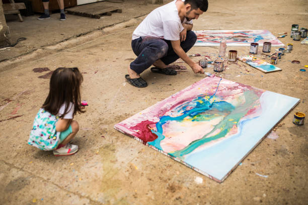 istock Little girl enjoying with her father 1006751648
