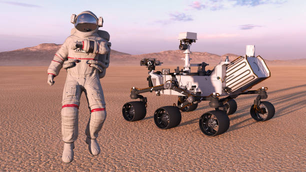 istock Astronaut with mars rover, cosmonaut next to robotic space autonomous vehicle on a deserted planet, 3D render 1006754282