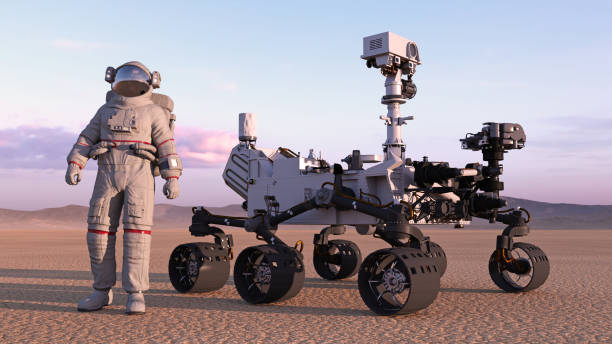 istock Astronaut with mars rover, cosmonaut standing next to robotic space autonomous vehicle on a deserted planet, 3D rendering 1006754370