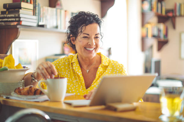 Mature woman working at home