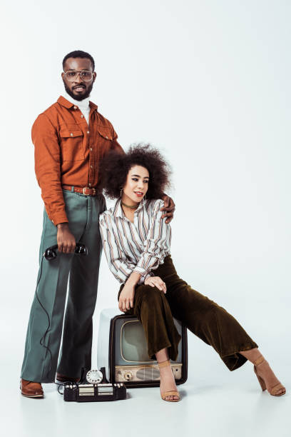 istock african american retro styled boyfriend hugging girlfriend on white 1006767046