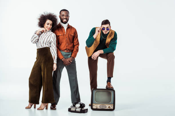 istock smiling multicultural retro styled friends with vintage electronics looking at camera on white 1006767096