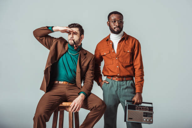 istock multicultural retro styled friends with pipe and radio looking away isolated on grey 1006767214