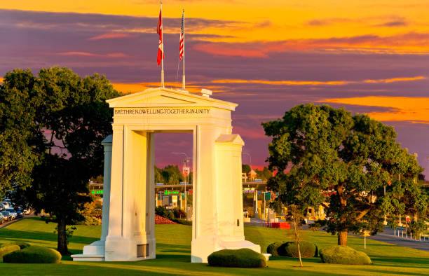Peace Arch at Sunset The Peace Arch on the USA/Canada Border was built to dedicate 100 years of peace between the United States and Canada. The project was commissioned in the early 20th century by the wealthy railroad executive and entrepreneur Sam Hill who was also a Quaker pacifist. The Peace Arch, built in 1921, is located between Douglas, British Columbia, Canada and Blaine, Washington State, USA. blaine washington stock pictures, royalty-free photos & images