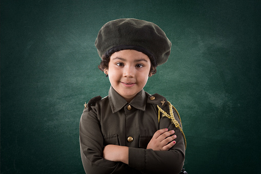 Cute little girl posing in police costume