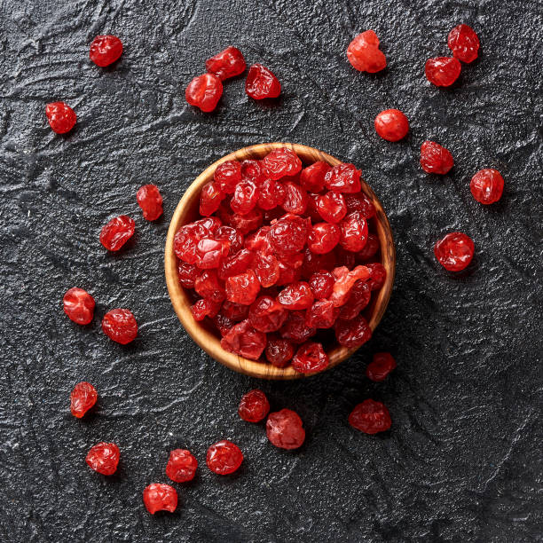 istock Dried red cherries on a black background 1006770900