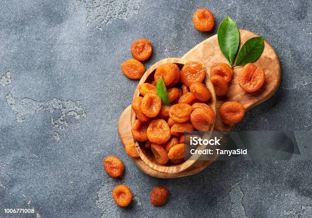 Dried Apricots On Gray Background Copy Space For Text Top View Stock Photo - Download Image Now