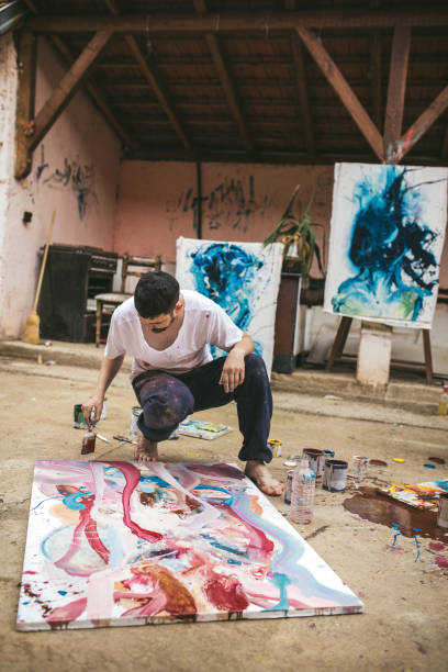 istock Young man loving to paint 1006771262