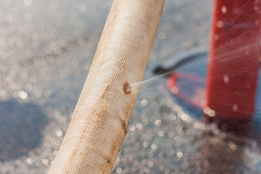 Fire Hydrant Injuries Damaged Fire Hose From A Fire Hydrant Water Spray Stock Photo ...