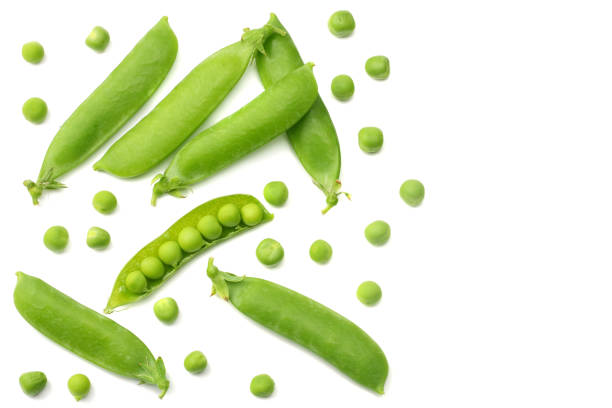 istock fresh green peas isolated on a white background. top view 1006781616