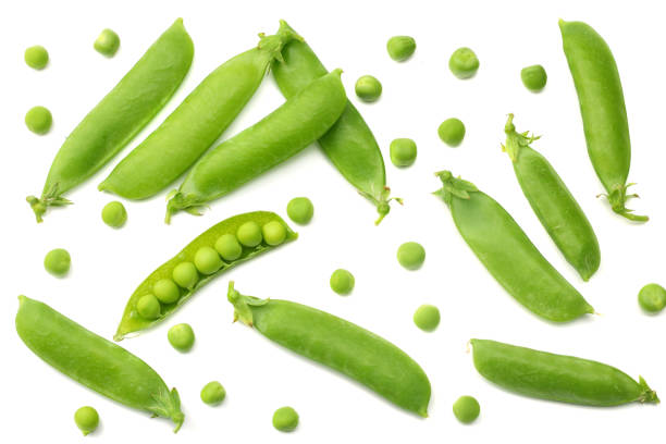 istock fresh green peas isolated on a white background. top view 1006781630