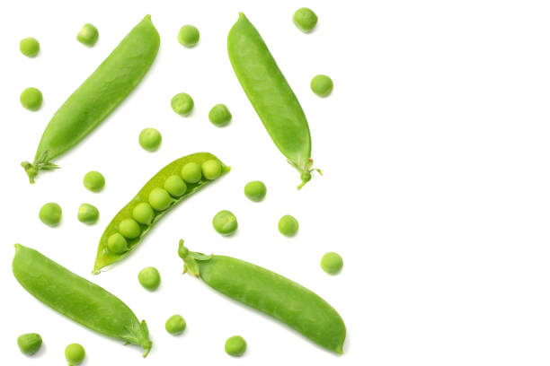 istock fresh green peas isolated on a white background. top view 1006781684