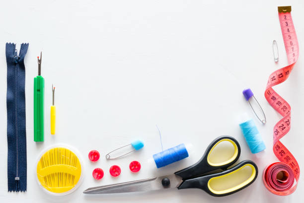 istock Thread and sewing accessories on white background with place for text 1006798614