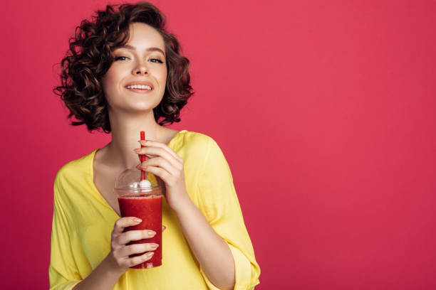 istock Woman drinking detox juice 1006807700