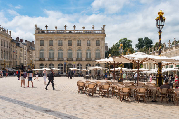 Nancy, France - 21 June 2018: People walk in the Place Stanislas square in the morning.