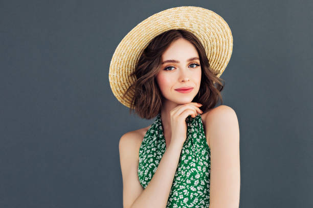 istock Young beautiful woman wearing hat 1006811902