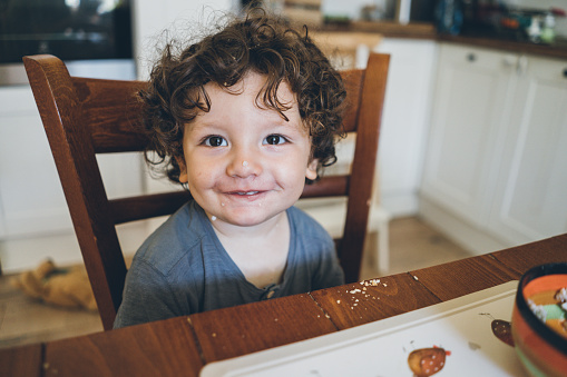 Cute little boy Eating lunch and making mess