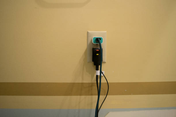 istock Cords Plugged into an electric outlet 1006815612